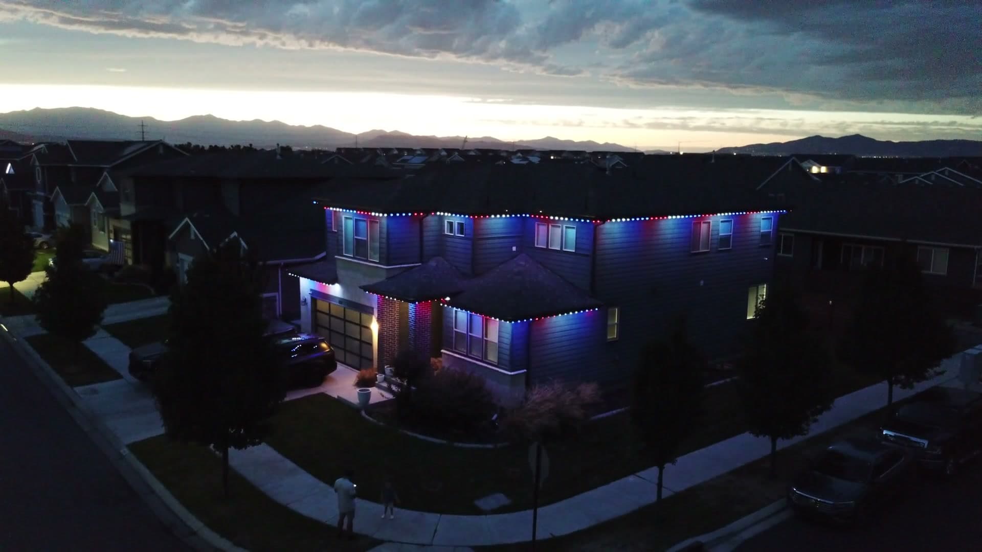 Utah home with permanent LED lighting at dusk