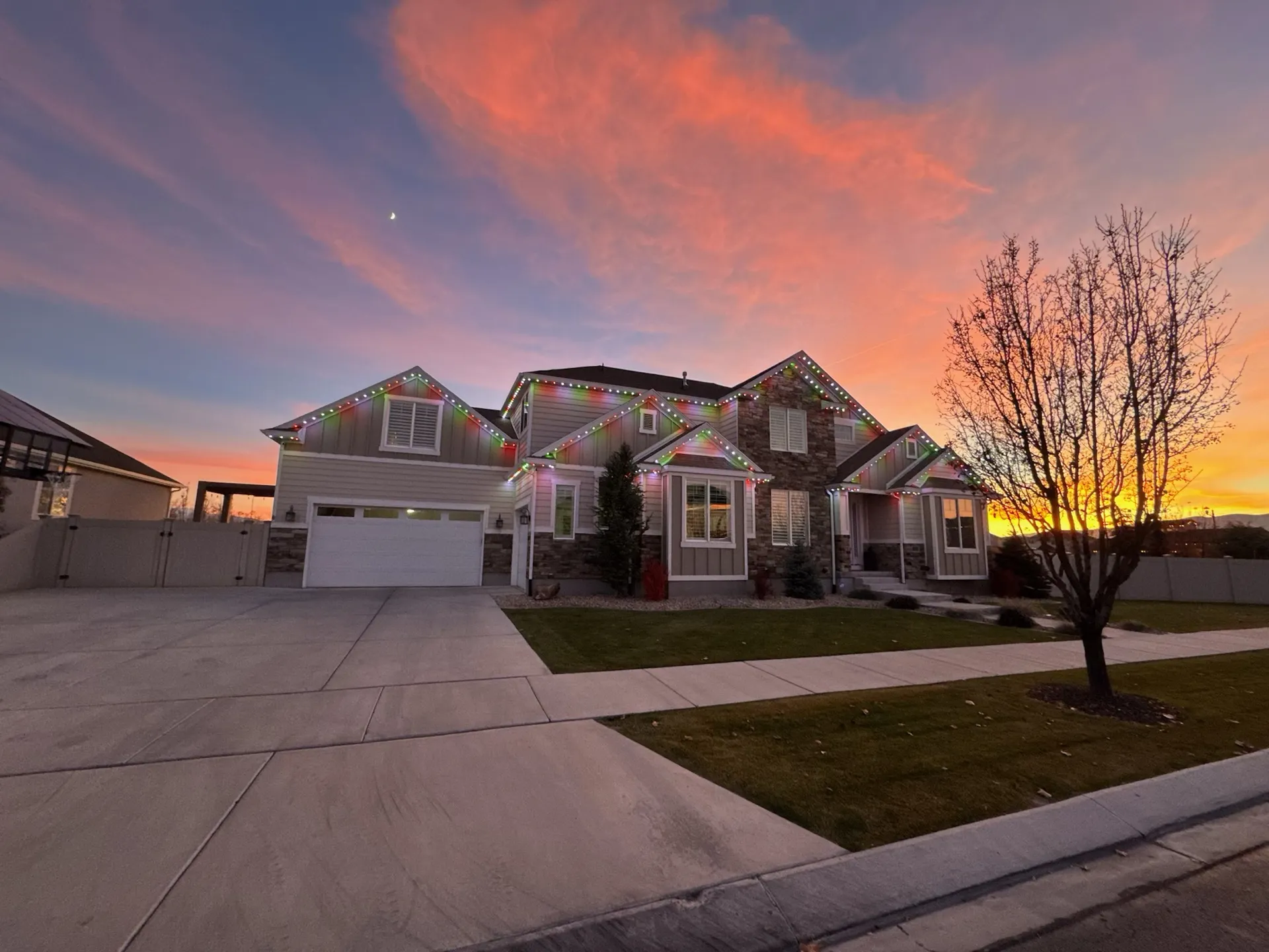 Craftsman-style home with warm permanent LED soffit lighting